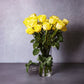 long stemmed yellow roses in a vase