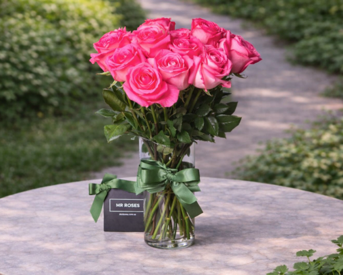 medium stemmed pink roses in a vase