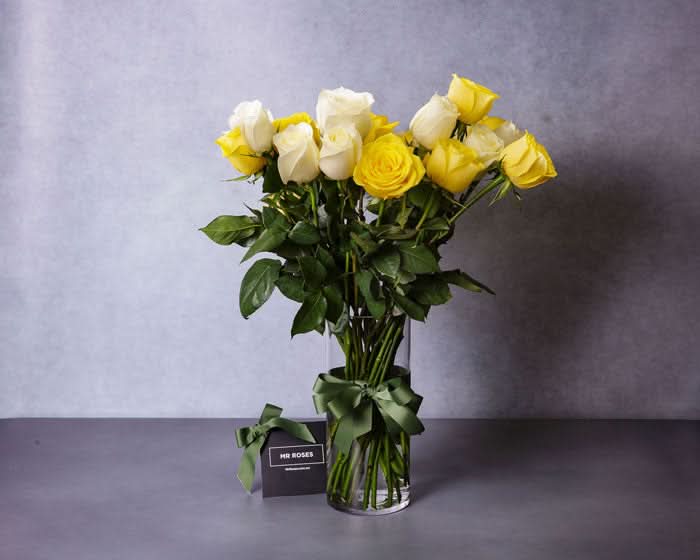 white and yellow long stemmed roses