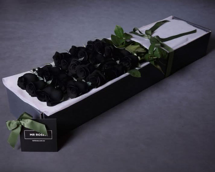 boxed black roses