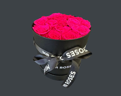 pink preserved roses in hat box
