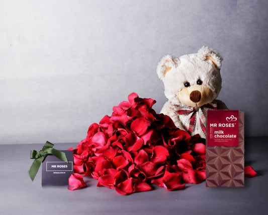 valentine's day red rose petals and gifts