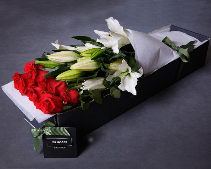 Fragrant white lilies and red roses flower arrangement in Mr Roses gift box